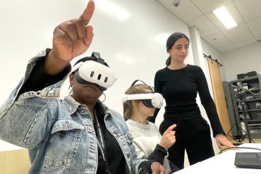 At OROT’s offices in the JGH, Nursing Educators Chedly Augustin (left) and Julie Verville (centre) wear VR headsets for a training session on immersive technology. They’re assisted by Johana Dahan (standing), a Planning, Programming and Research Officer in the Directorate of Learning Partnerships and Knowledge Activation.